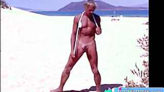 Tanned guy on beach in tiny string thong (temporarily!) 11