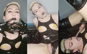 Kinky sissy in shiny latex bodysuit and high boots plays with cock and cums in her mouth