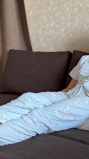 Farting in Pajamas on a Pillow While Sitting on the Couch