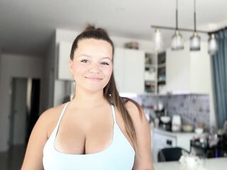A gal with large boobs and a large booty tries on Swimsuits
