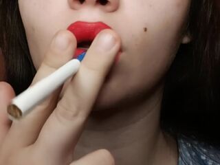 Large red lips smokin' close up