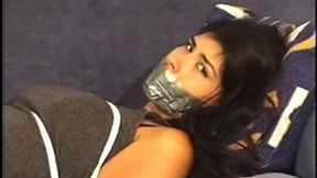 Lovely brunette Becky Rico struggled bound and gagged on a couch, her bare feet tickled after her sandals were removed!