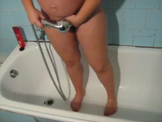 My pregnant busty wife in the shower room filmed on cam