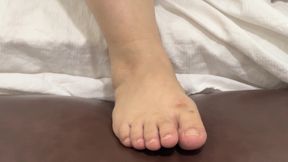 Pretty Girl Grooming Her Cute Feet with Fresh Nail Polish
