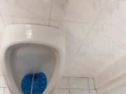 Peeing and moaning after pee desperation at the public urinal