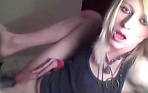 Platinum blonde emo tgirl does a bit of softcore posing