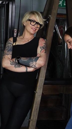 Slave Mila's Feet Dangle and Quiver as Mistress Baton Breaks in Heavy Wooden Paddle Over Her Jeans and Bare