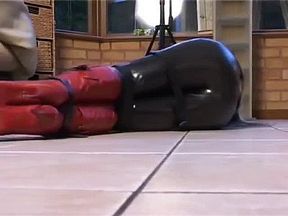 Latex catsuit bondage and ball gagged