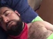Big bearded and hairy bear wanking rubbing the bed sheet on his hard and wet cock. Beautiful Agony