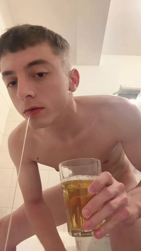 A twink drinks his own piss from a cup
