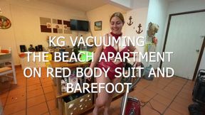KG VACUUMING THE BEACH APARTMENT IN RED BODYSUIT AND BAREFOOT