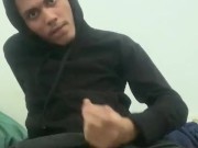 Latino teen in hoodie rubs his cock and masturbates