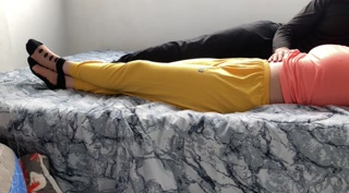 Relaxing massage while watching a movie with an Iranian MILF on the bed