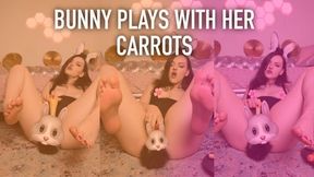 Bunny plays with her carrots