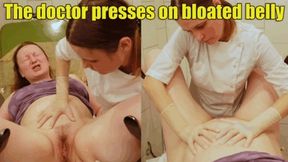 The doctor presses on the patient’s bloated belly, and she screams and strains (4k)