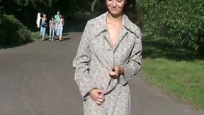 Fabulous brunette Russian teen cutie in coat outside flashes her goodies