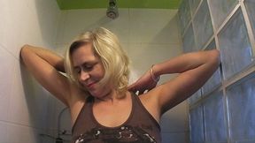 #27: Granny Violett peeing in jeans shorts in the shower - from Hungary