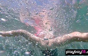Skinny blonde ukrainian teen Clarise reveals her small tits in the pool