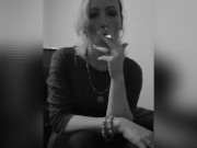 Smoking a cigarette after work.