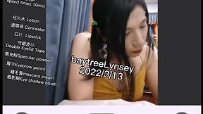 Ms. lynsey applies makeup on webcam