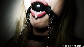 ”Ballgagged blonde Lucy Heart rams her butt with a glass dilco”