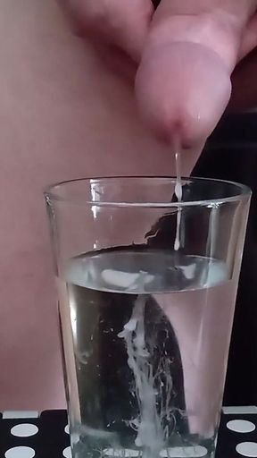 Cumming in a glass of hot water