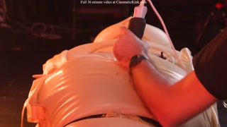 Emily Addams in inflatable latex sack