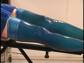 Latex clad babe doing bondage with friend