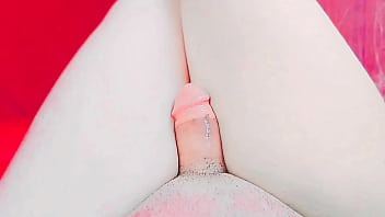 Gorgeous femboy wearing silk slip under warm lights