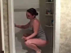 Hot milf cleaning the shower showing her ass