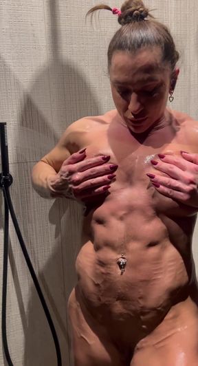 Female bodybuilder in shower