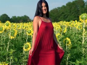 Asian teen posing in sunfolower field