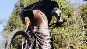 Slim boy with his bike in the park