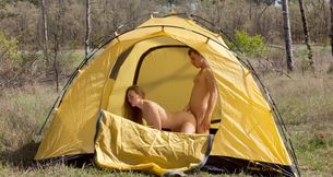 Horny young couple fucking in a tent