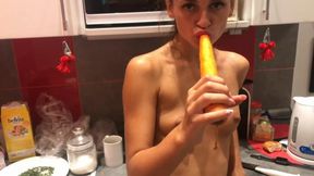 So beautiful and horny brunette pornstar .She's in the kitchen but she becomes horny and peels a long carrot which she then sticks in her pussy until