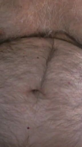 Coach Karl Shows off His Furry Belly