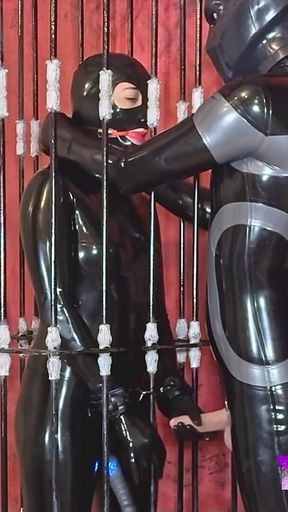 Imprisoned Rubber Slut Has to Give a Blowjob