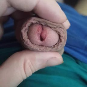 The guy shows his penis head in close-up, jerks off his penis