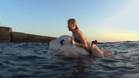 Alla rides a rare inflatable transparent whale on the waves and comes ashore and deflates the inflatable whale by opening the air valves!!!