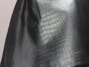 Femboy tries on women's blouse and skirt in store fitting room