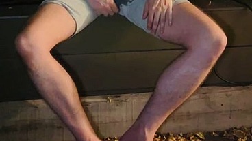 Amateur boy pee on himself in the garden (wets his grey shorts, grey undies and white tshirt)