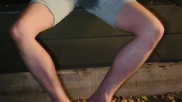 Amateur boy pees himself in the garden (wets his grey shorts, grey undies and white tshirt)