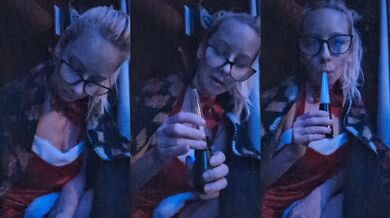 Blonde smoking in her festive dress on Christmas