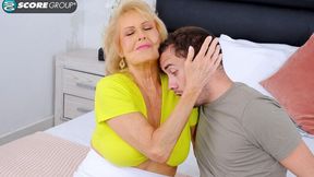Spicy big-bottomed mature Desiree Eden fucks with a young man