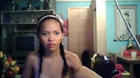 Hot and petite Asian webcam model flashes her small tits