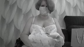 A mature BBW milf with big natural saggy tits tries on bras.