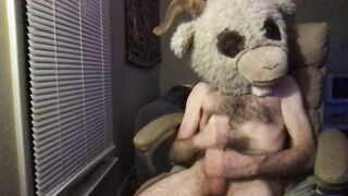 Lean fur covered white guy in a goat mask strokes off in a tabouret