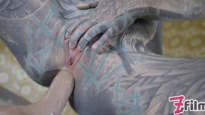 Tattooed beauty exploring her favorite toy with intense passion