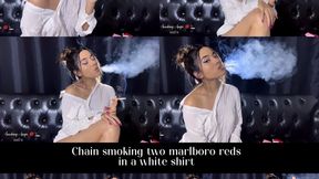 Chainsmoking two Marlboro reds in a white shirt