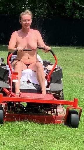 Titties out Riding lawnmower outdoors   Clip 1
